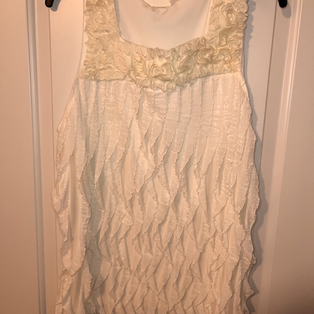 Sleeveless eggshell white blouse